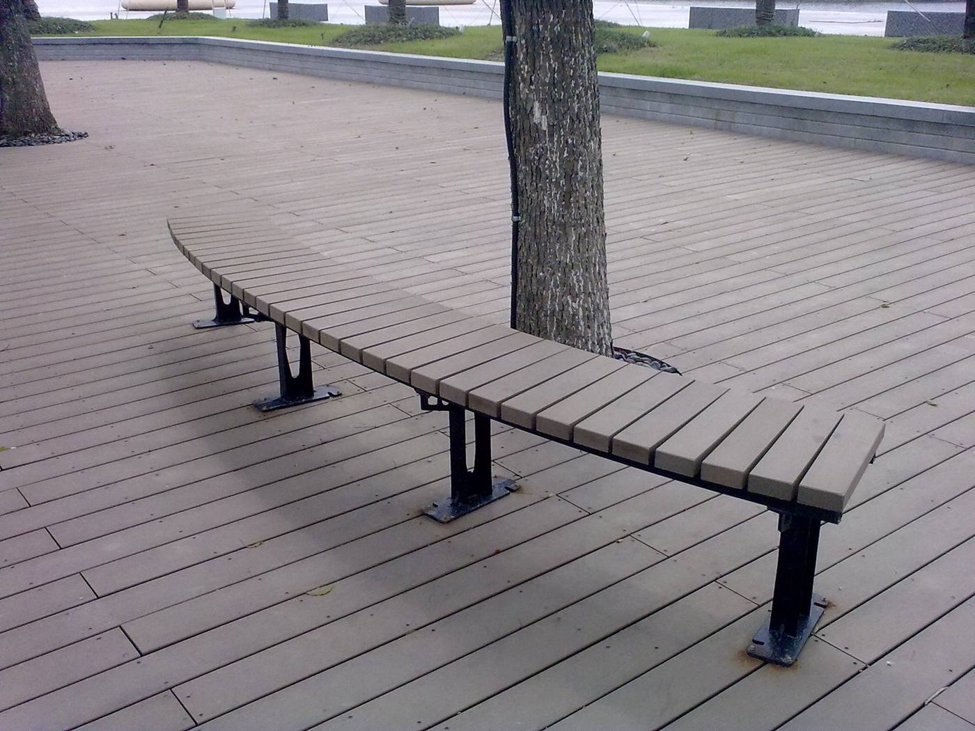 Public-space WPC bench and paving in a municipal park
